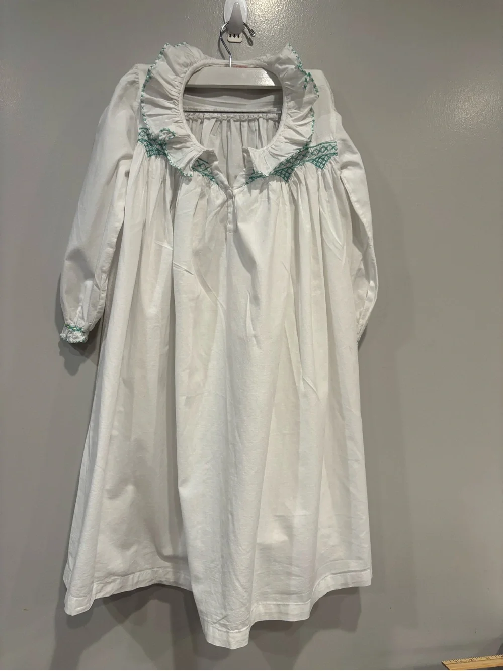 White Girls' Long Sleeve Dress with Mint Smocking Detail Hand Smocked.